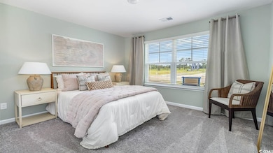 Bedroom featuring carpet flooring
