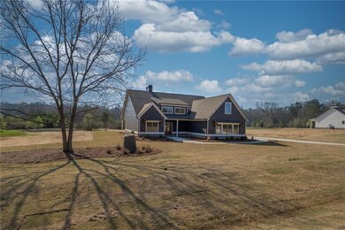 View of front of home with a front lawn, a chimney