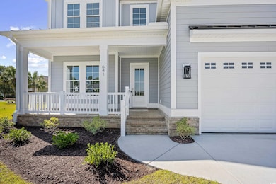 Doorway to property with covered porch