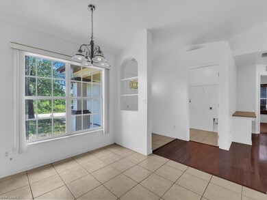 Unfurnished dining area featuring tile patterned f