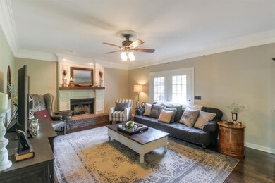 Living Room with Fireplace and Wood Flooring