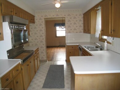 2nd view of the kitchen looking into the dining ro