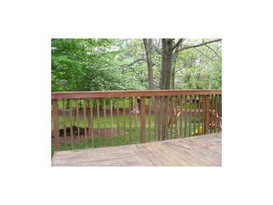 LARGE DECK THAT LEADS FROM THE WOODEN SLIDER IN THE KITCHEN.