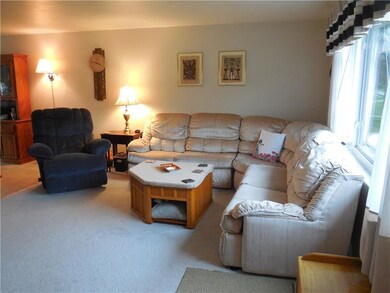 Spacious living room can accommodate the wrap arou