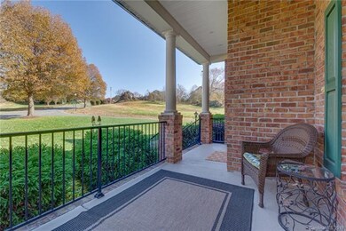 View from the front porch and the entry into the community.  Nice large corner lot with great views all around.
