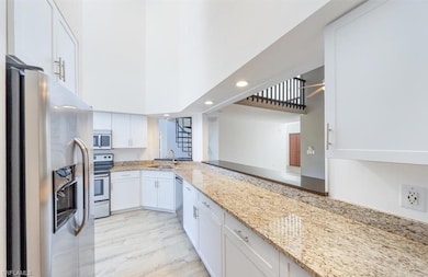 Kitchen with sink, appliances with stainless steel