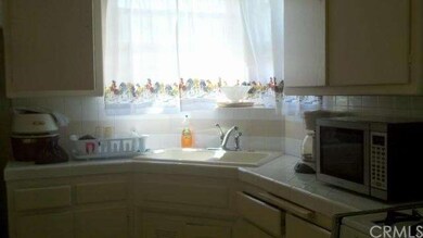 Kitchen window facing street.