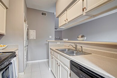 Double sink, and vegetable sprayer make kitchen pr