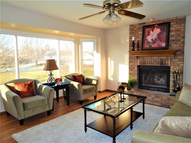 Family room with bay window, wood flooring, ceilin