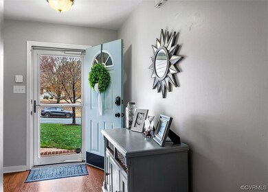 Foyer with dark wood-type flooring