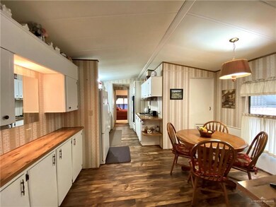 Dining space featuring dark wood-type flooring
