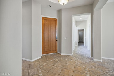 Entrance foyer featuring inlaid floor details