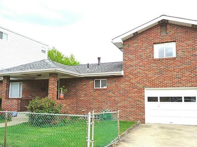 Exterior Front. Large brick home with 1 car garage