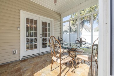 Sunroom / solarium featuring french doors