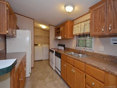 Kitchen to Laundry, which opens to screened back p