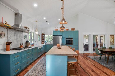 Kitchen with stainless steel appliances, dark wood