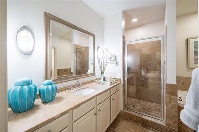 The primary suite's ensuite bath serves as a spa-l