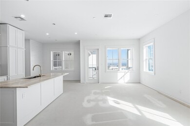 A generously sized kitchen and adjoining living ar
