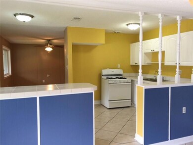 Eat-in kitchen has a bar and extra room for dining
