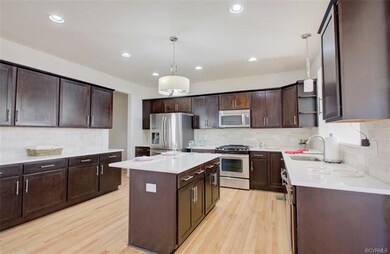 Large kitchen with island, S/S appliances, tile ba