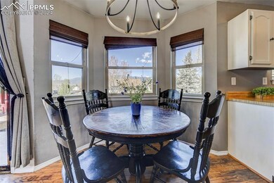 The dining area is nestled into a large bay window