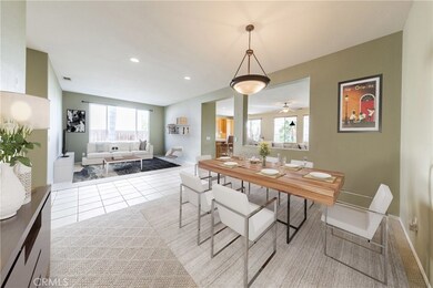 Formal dining room and living room features berber carpet and custom paint throughout