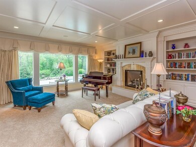 Gracious formal living room with paneled ceiling d