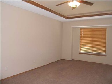 The master bedroom features a coffer with crown mo
