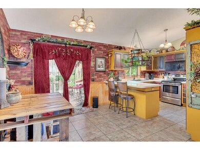 The kitchen cabinets and informal dining area are 