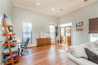 Living Room view with Entry and additional space.