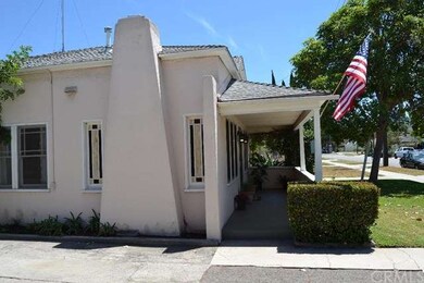 View of front porch and stained glass windows on e