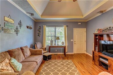 Living Room with Fireplace, soft blue paint and hardwood floors