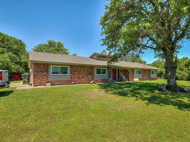 Single story home featuring a front lawn