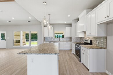 Kitchen window looks out to back porch