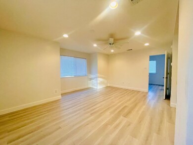 Open floor plan with living, dining room with recessed lighting, light wood finished floors, and ceiling fan