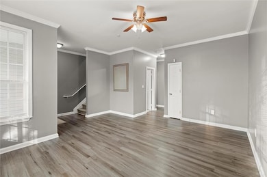 Unfurnished living room with wood finished floors,