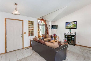 Tile entry into living room with vaulted ceiling &