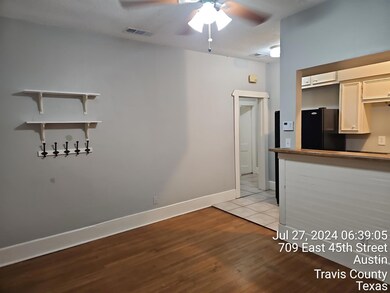 Kitchen with freestanding refrigerator, a ceiling