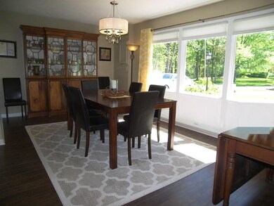 Formal dining room has huge windows and gorgeous v