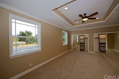 Master bedroom with beveled mirror closet doors an