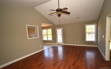 Great Room has hardwood flooring, vaulted ceiling 