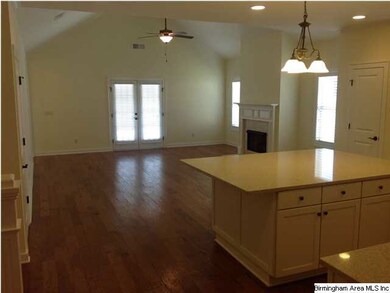 Very large open living/kitchen area that has a HUG