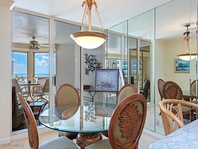 Dining space with carpet flooring, plenty of natural light, ceiling fan, and a water view