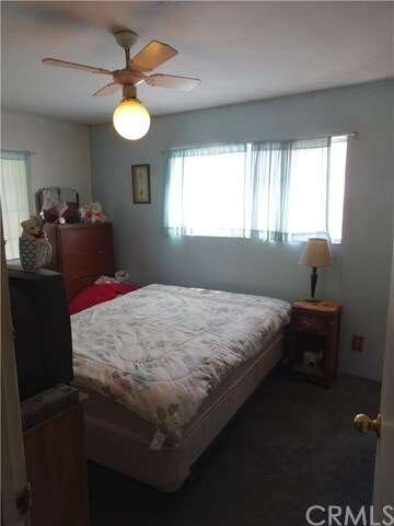 Light and Bright Master Bedroom with ceiling fan