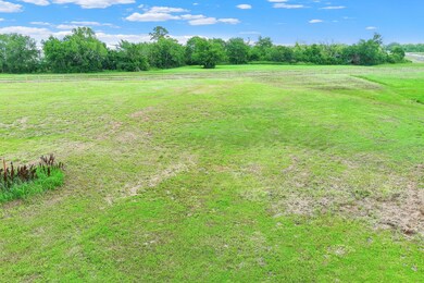 Pearland Airport is just on the other side of the creek and tree line. You wouldn't know it when standing on the beautiful 3 acre property!
