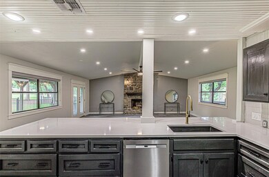 Kitchen with dishwasher, a sink, a peninsula, lof