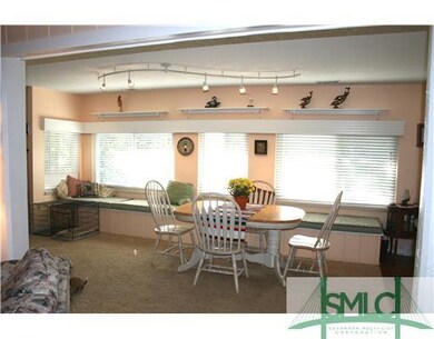 Dining Room. The window seat offers additional sto