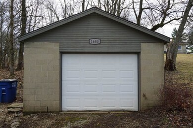 This 1 Car Detached Garage allows for more drivewa