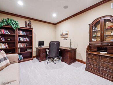 Home office featuring ornamental molding, light colored carpet, and recessed lighting