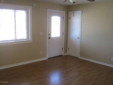 Living room front door & coat closet